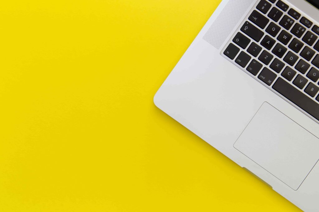 macbook pro against yellow background
