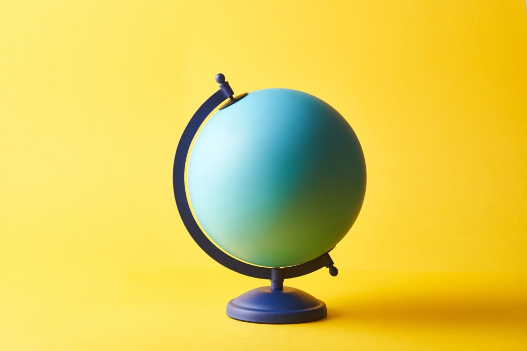globe against a yellow background